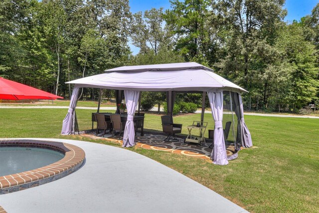 view of home's community with a gazebo, a yard, and a patio