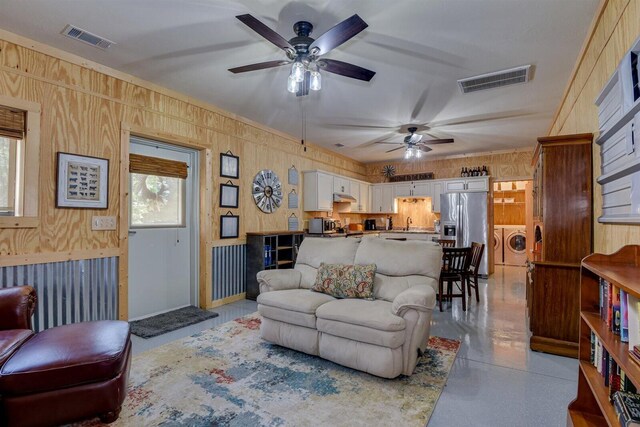 1370 Deerwood Cir, Stapleton, GA 30823 - living room with independent washer and dryer and a ceiling fan
