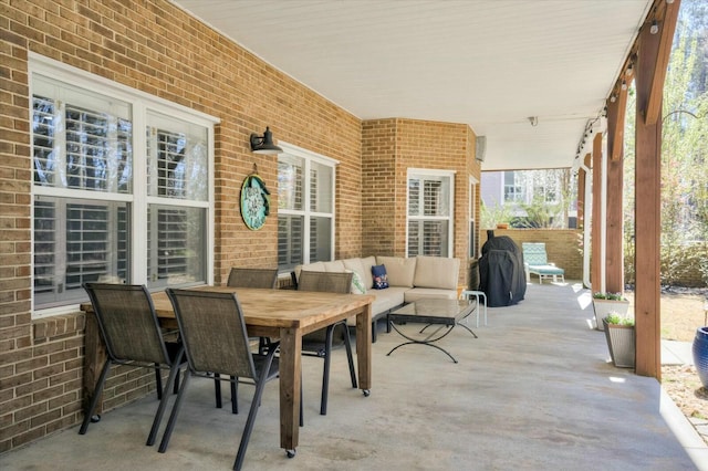 view of patio / terrace featuring a grill, outdoor dining space, and outdoor lounge area