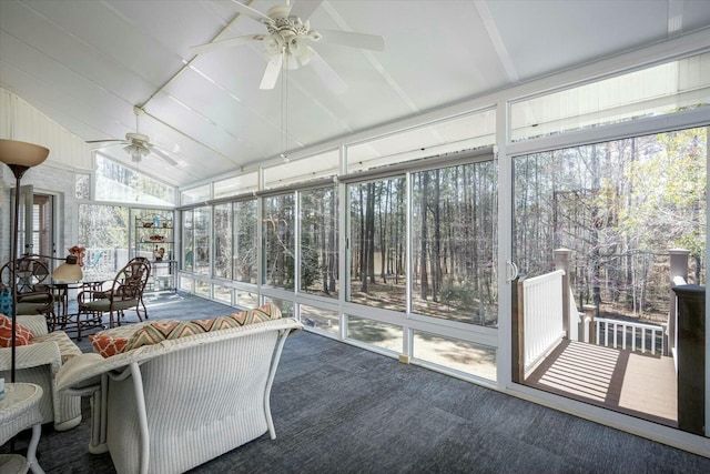 sunroom / solarium featuring lofted ceiling and a ceiling fan