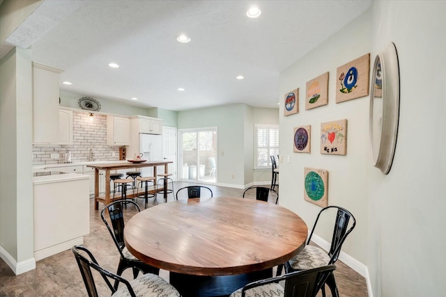 dining area with recessed lighting and baseboards