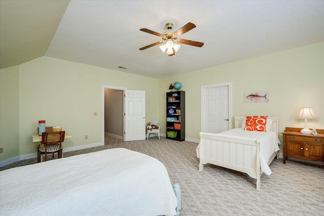 bedroom featuring visible vents, lofted ceiling, a ceiling fan, carpet floors, and baseboards