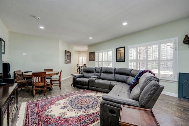 living area featuring recessed lighting, wood finished floors, and baseboards