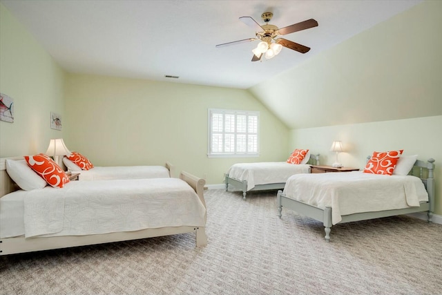 carpeted bedroom with visible vents, baseboards, ceiling fan, and vaulted ceiling