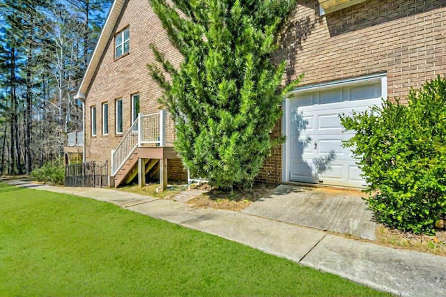 111 Stonebridge Loop, Mccormick, SC 29835 - exterior space featuring brick siding, a lawn, and a garage