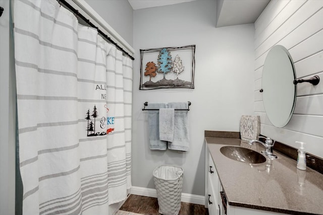 bathroom with baseboards and vanity