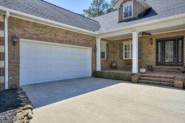 exterior space with brick siding, roof with shingles, covered porch, and driveway