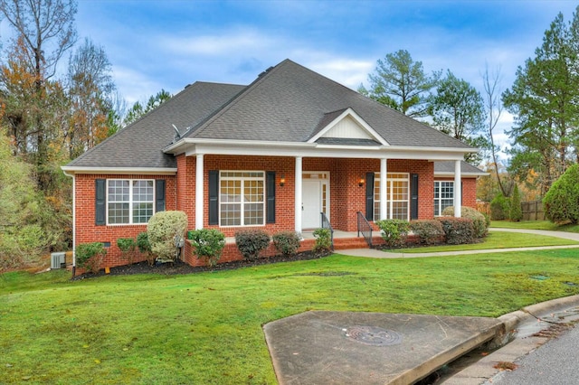 view of front facade with a front lawn and covered porch