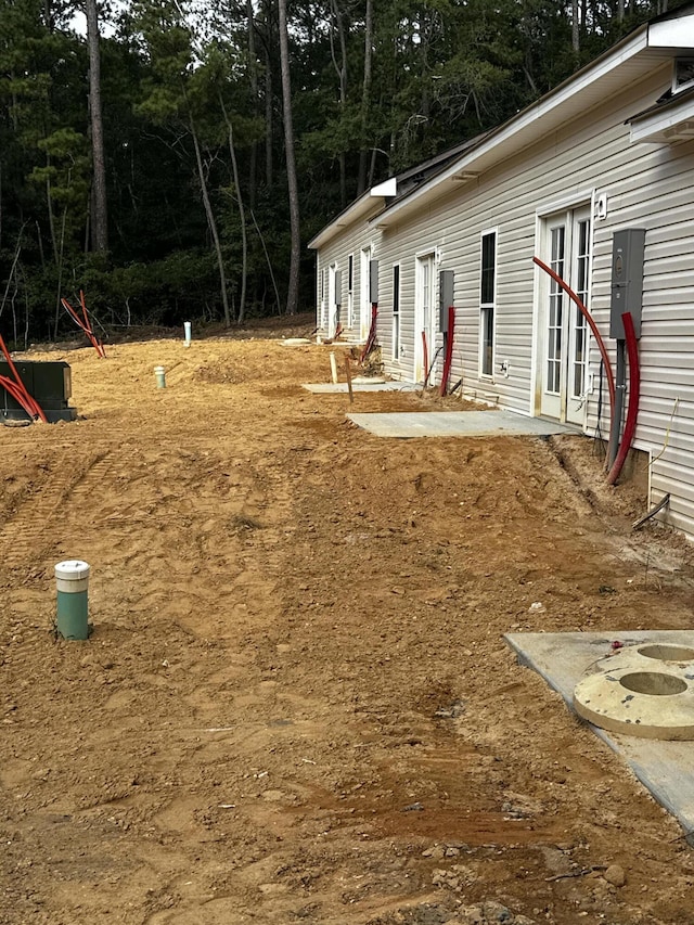 view of storm shelter featuring a patio area