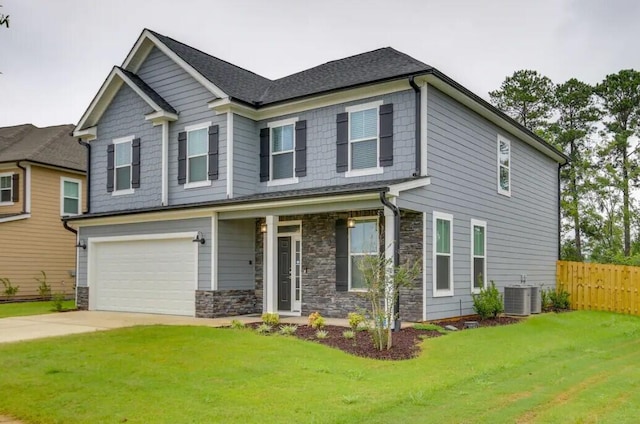 3120 Wayne Dr, Evans, GA 30809 - craftsman-style home featuring driveway, stone siding, central air condition unit, and a garage