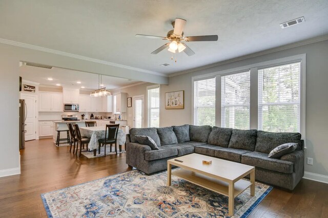 3120 Wayne Dr, Evans, GA 30809 - living area with dark wood-style floors, a ceiling fan, baseboards, crown molding, and recessed lighting