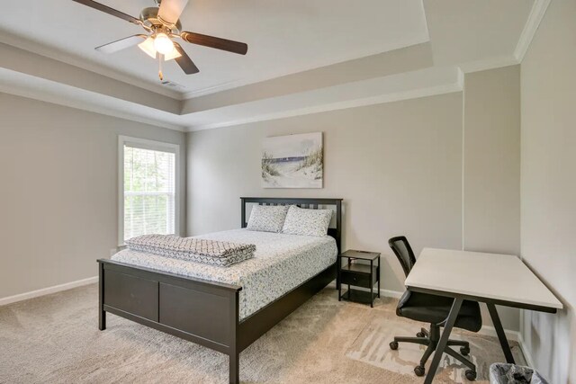 3120 Wayne Dr, Evans, GA 30809 - bedroom featuring crown molding, a tray ceiling, light carpet, baseboards, and a ceiling fan