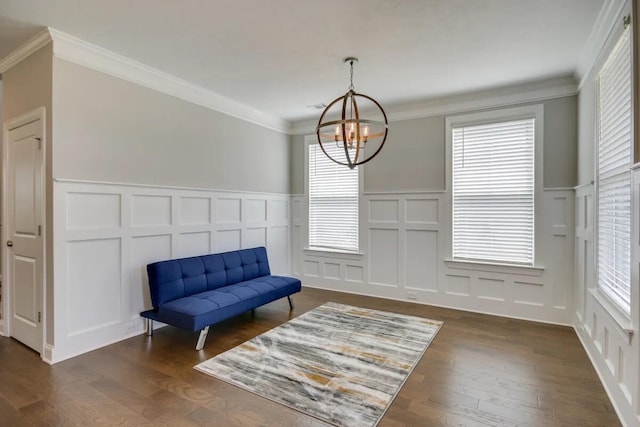 3120 Wayne Dr, Evans, GA 30809 - sitting room featuring a decorative wall, a chandelier, crown molding, plenty of natural light, and dark wood-style floors