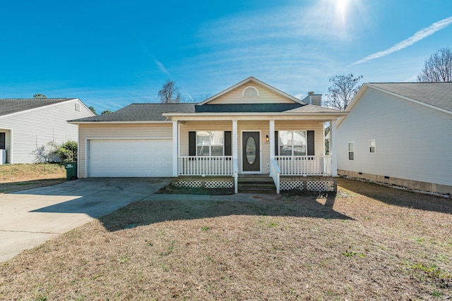 view of front facade with a chimney, covered porch, concrete driveway, an attached garage, and a front yard