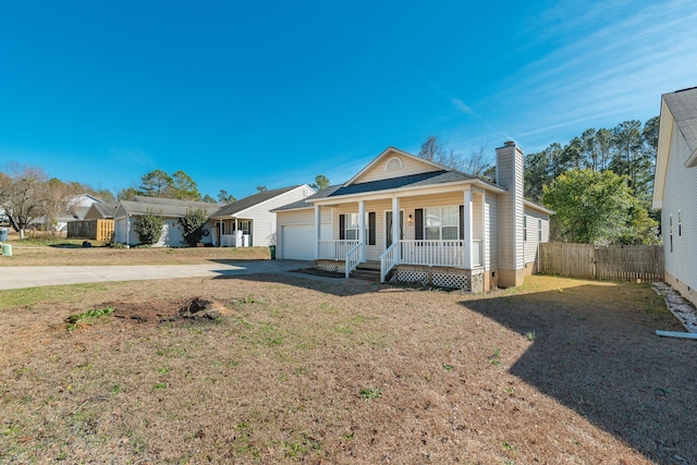 view of front of home featuring concrete driveway, a chimney, an attached garage, covered porch, and fence