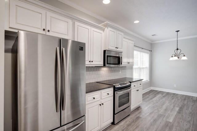 750 Herrington Dr, Grovetown, GA 30813 - kitchen featuring light wood-style floors, stainless steel appliances, baseboards, ornamental molding, and backsplash