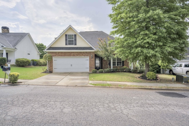 750 Herrington Dr, Grovetown, GA 30813 - view of front of home featuring a front yard, a shingled roof, brick siding, concrete driveway, and an attached garage