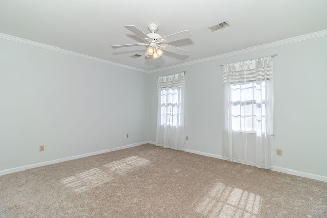 unfurnished room featuring crown molding, ceiling fan, and light carpet