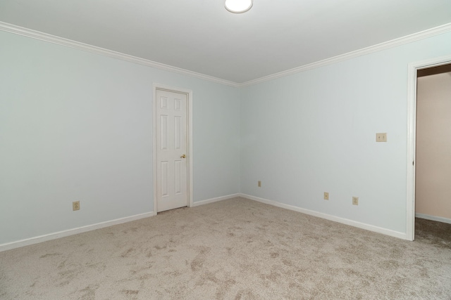 carpeted spare room with ornamental molding