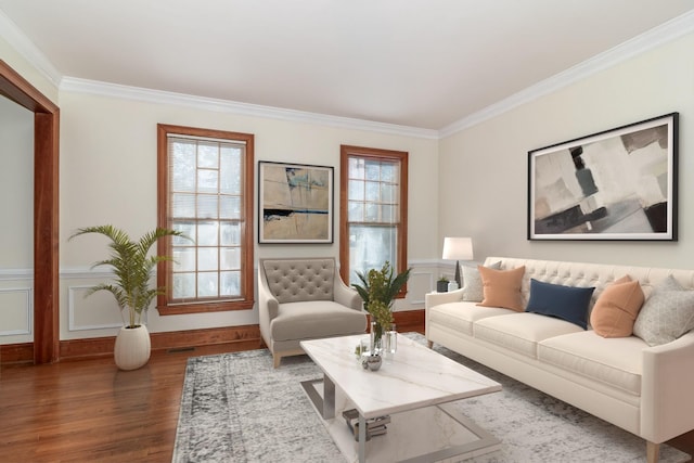 living room featuring dark hardwood / wood-style flooring and crown molding