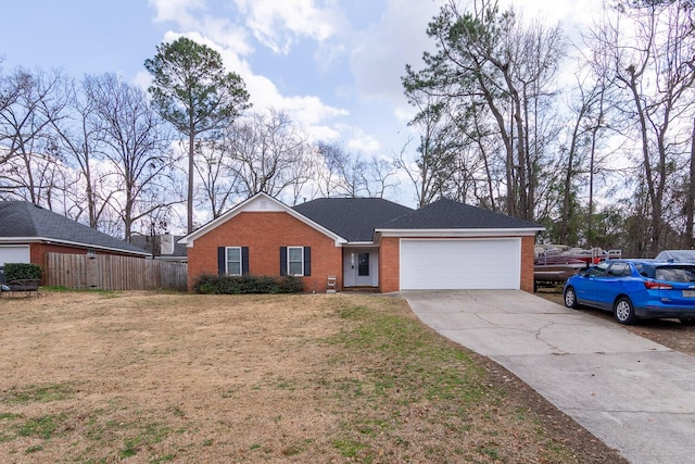 ranch-style home with a garage and a front yard