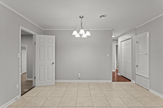 2131 Reedale Ave, Augusta, GA 30906 - empty room with crown molding, a chandelier, light tile patterned floors, and baseboards