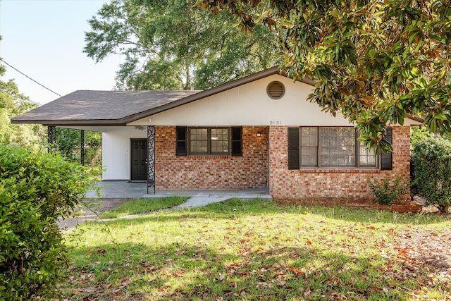 2131 Reedale Ave, Augusta, GA 30906 - view of front facade featuring a front lawn, an attached carport, and brick siding
