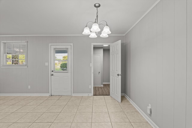 2131 Reedale Ave, Augusta, GA 30906 - unfurnished dining area featuring ornamental molding, a chandelier, baseboards, and light tile patterned flooring