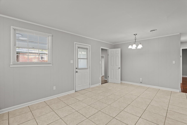 2131 Reedale Ave, Augusta, GA 30906 - empty room with ornamental molding, a chandelier, baseboards, and light tile patterned floors