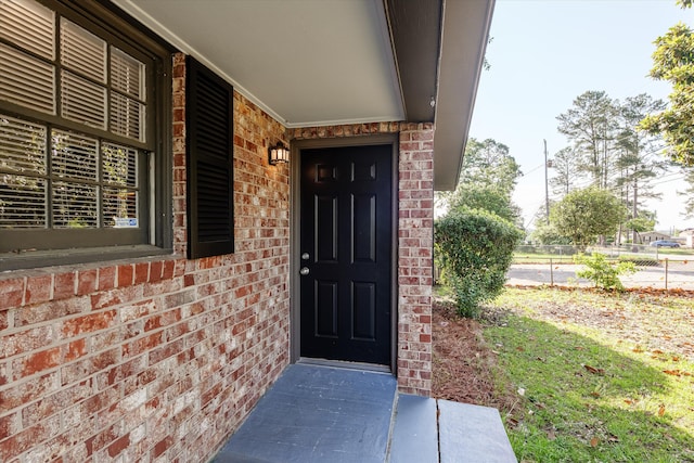 2131 Reedale Ave, Augusta, GA 30906 - view of exterior entry with brick siding and a porch