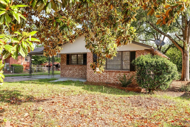 2131 Reedale Ave, Augusta, GA 30906 - view of front of home featuring brick siding and a carport