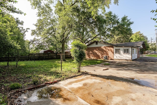 2131 Reedale Ave, Augusta, GA 30906 - view of yard featuring concrete driveway and central AC unit