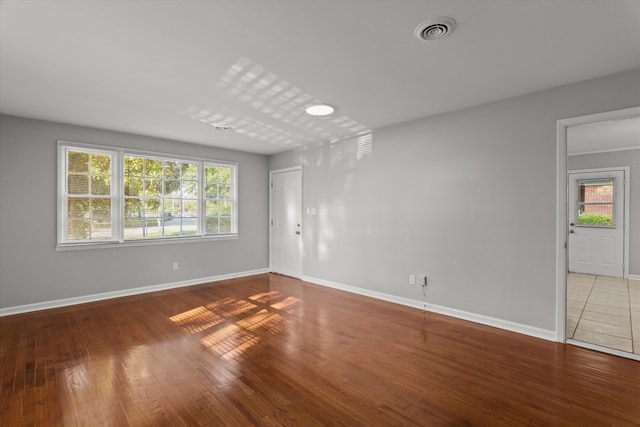 2131 Reedale Ave, Augusta, GA 30906 - empty room with healthy amount of natural light, wood finished floors, and baseboards