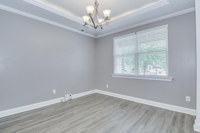 809 Richards Ct, Grovetown, GA 30813 - spare room featuring a chandelier, wood finished floors, and crown molding
