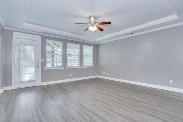 809 Richards Ct, Grovetown, GA 30813 - spare room with a tray ceiling, a ceiling fan, ornamental molding, and wood finished floors