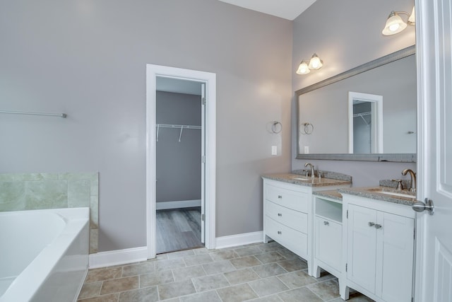 809 Richards Ct, Grovetown, GA 30813 - full bathroom with double vanity, a spacious closet, and a bath