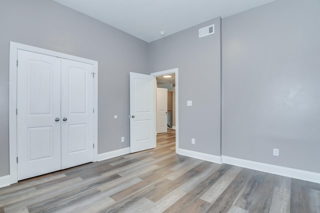 809 Richards Ct, Grovetown, GA 30813 - unfurnished bedroom with light wood-style floors and a closet