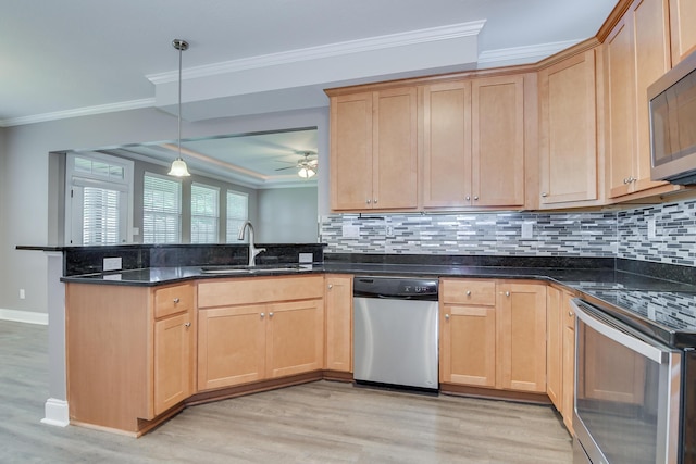 809 Richards Ct, Grovetown, GA 30813 - kitchen featuring stainless steel appliances, crown molding, a peninsula, light wood finished floors, and decorative backsplash