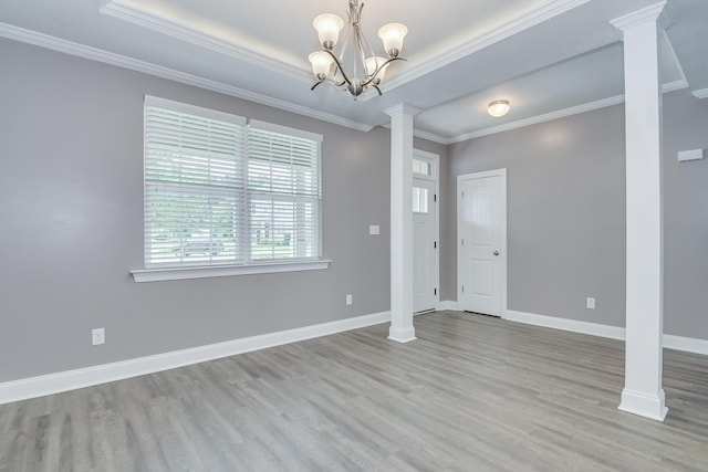 809 Richards Ct, Grovetown, GA 30813 - unfurnished room with decorative columns, wood finished floors, crown molding, and a chandelier