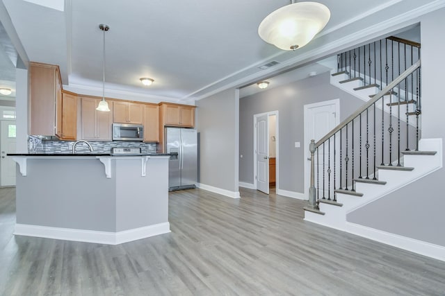 809 Richards Ct, Grovetown, GA 30813 - kitchen with stainless steel appliances, light wood-style floors, and dark countertops