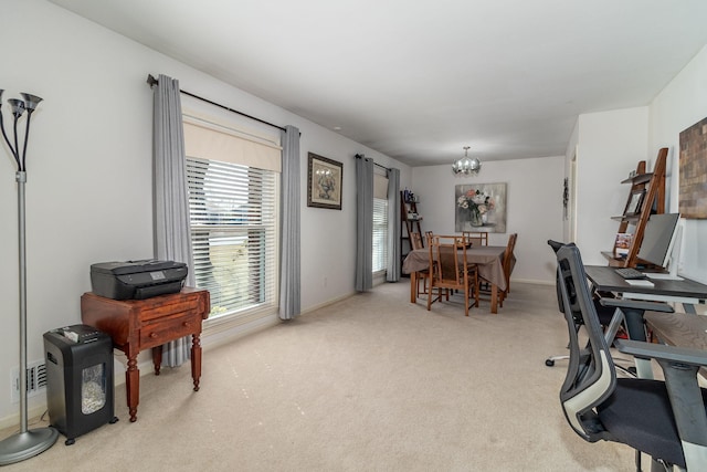 office area featuring baseboards, a chandelier, and carpet flooring