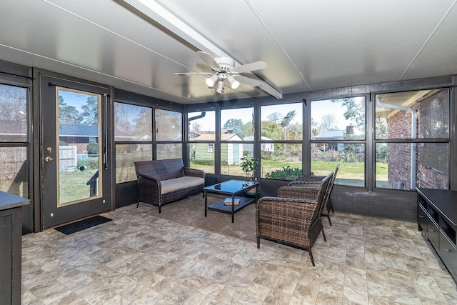 sunroom / solarium with plenty of natural light and ceiling fan