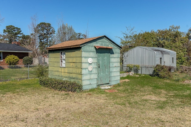 view of shed with fence