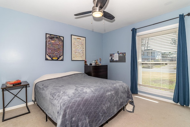 bedroom with baseboards, ceiling fan, and carpet flooring