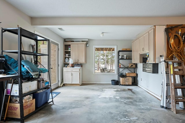 interior space featuring baseboards and visible vents