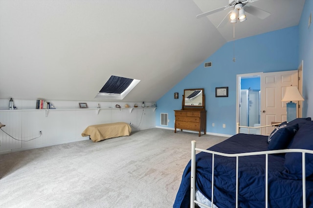 carpeted bedroom featuring visible vents, vaulted ceiling, baseboards, and ceiling fan