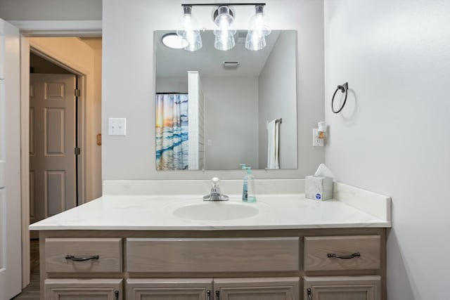 bathroom featuring visible vents and vanity