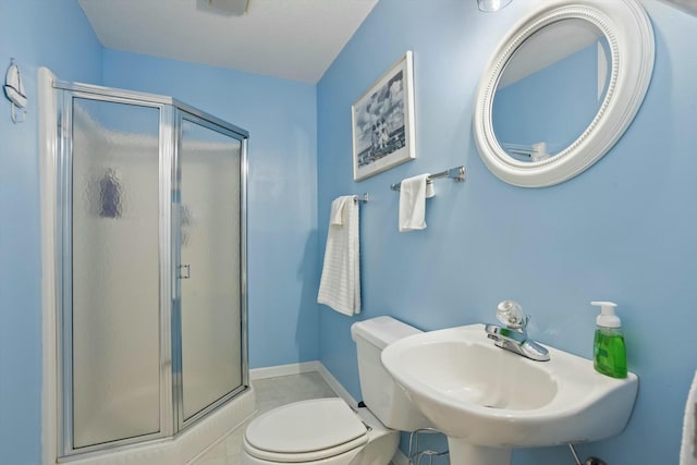 full bathroom with a sink, a shower stall, and toilet