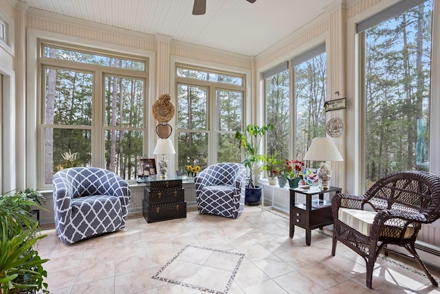 sunroom with a ceiling fan