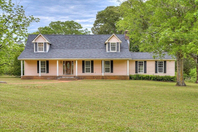 cape cod home featuring a porch and a front yard